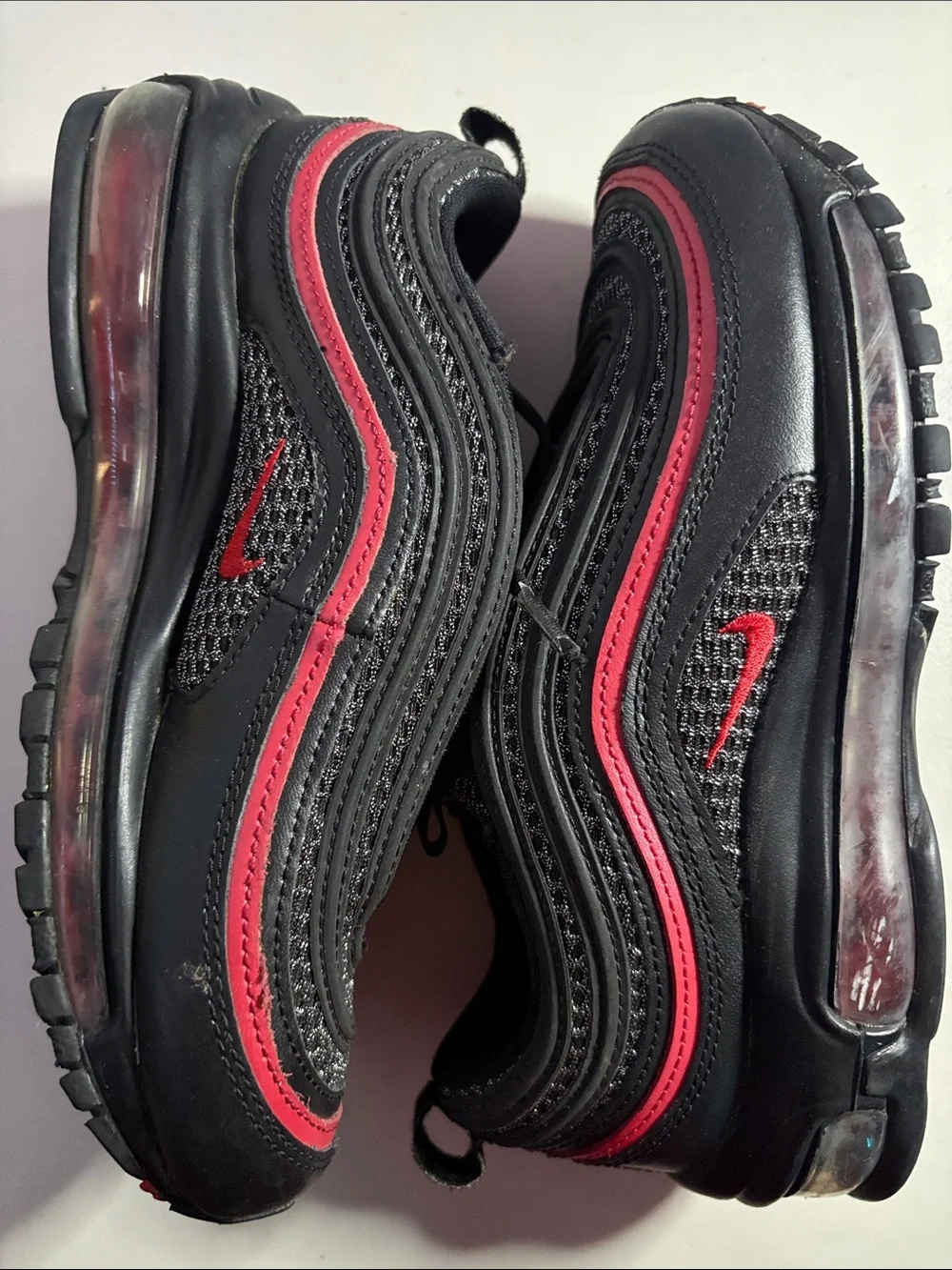 Unisex Nike AirMax (6) Black Sneakers with Red Trim.